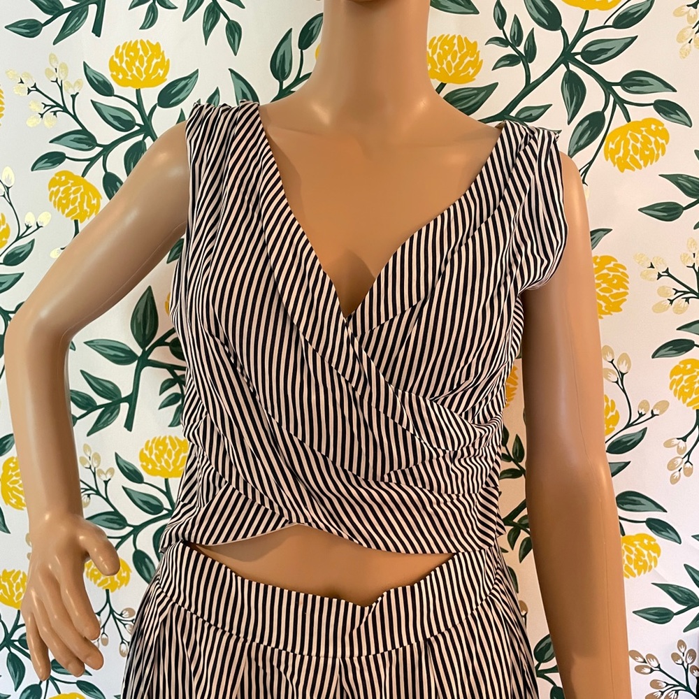 Navy/white striped boutique dress.CrissCross bodice w/ peekaboo detail & pockets